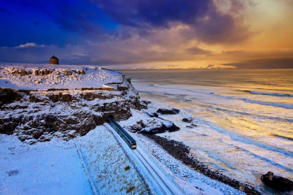 Mussenden Temple with the Translink train passing below at Downhill